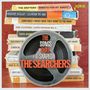 "The Songs That Shaped The Searchers." Kassettenstapel mit Musiktiteln. Großes Tonband im Vordergrund. Jasmine-Logo oben rechts.
