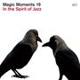 Text: "Magic Moments 19 In the Spirit of Jazz". Zwei schwarze Vögel, die einander zugewandt sind auf weißem Hintergrund.