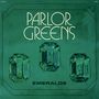 PARLOR GREENS EMERALDS. Drei grüne, glitzernde Smaragde auf grünem Hintergrund.