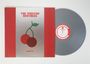 „THE WINSTON BROTHERS“ in Rot auf silbernem Hintergrund, zwei Kirschen darunter. Graue Vinyl-Schallplatte rechts.