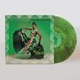 "IBIBIO SOUND MACHINE CHOPPING MOUNTAIN." Eine Person in einem grünen, gemusterten Kleid posiert dynamisch. Grüne Schallplatte.