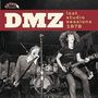 "DMZ lost studio sessions 1978." Rockband mit drei Musikern auf einer Bühne in dynamischer Pose.