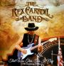 „The Rex Carroll Band“ in stilisierter Schrift oben. Unten: „That Was Then, This Is Now (15th Anniversary Edition)“. Ein Gitarrist mit Hut spielt auf einer Bühne.