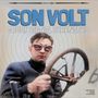 "SON VOLT SOUND SIGNAL SERENADES" oben. Mann mit Schutzbrille hält Lenkrad, konzentrische Kreise im Hintergrund.