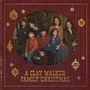 Text: "A Clay Walker Family Christmas". Eine Familie sitzt zusammen, umgeben von weihnachtlichen Dekorationen.