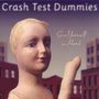 Text: "Crash Test Dummies" und "Give Yourself a Hand". Eine Schaufensterpuppe hebt ihre Hand vor einer städtischen Kulisse.