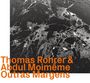 "Thomas Rohrer & Abdul Moimême Outras Margens". Schwarzes, abstrahiertes Muster in Weißtönen; kunstvolle Textur.