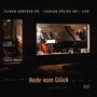 "Tilman Günther (P) Florian Dölling (B) Live, Rede vom Glück. Menschen spielen Musik in einem beleuchteten Raum."