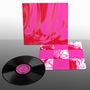 Texte: "Side A: Luna Haze", "Side B: My Pet Octu". Eine Vinyl-Schallplatte mit pinkem Cover und abstraktem Design.