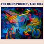 "The Blues Project / Live 2025" steht oben. Darunter eine abstrakte, bunte Illustration mit geometrischen Formen und Mustern.