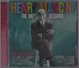 "Henry Mancini: The 100th Sessions" in bunten Buchstaben. Schwarz-weißes Foto eines Mannes im Anzug, Arme verschränkt.