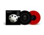 "Thievery Corporation / Culture of Fear." Zwei Schallplatten, eine schwarz, eine rot. Ein Cover mit weißem Ball und Löchern.