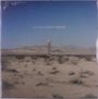 Text: "LOS DAYS DUSTY DREAMS". 

Öde Landschaft, Sand, spärliche Vegetation; im Hintergrund ein Wasserturm.