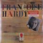 Text: "FRANÇOISE HARDY", "2-LP LIMITED PRESSING ON OPAQUE ORANGE VINYL." Holzoptik mit Schwarzweißfoto einer Frau.