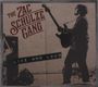 "The Zac Schulze Gang Live and Loud." Silhouette eines Gitarristen mit Verstärkern im Hintergrund.