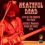 Text: "Grateful Dead Live at Ted Askey's Pig Farm, Leycett, Madeley, Stoke on Trent 1970. Double LP on 180gsm Heavy Vinyl."  
Ein Gitarrist spielt, warmes, rotes Farbschema.