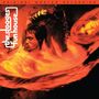 „The Stooges Funhouse“ in vertikaler Schrift. Zwei Personen in warmen, roten Tönen, dynamisch und intensiv dargestellt.