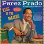 Text: "Perez Prado", "KING OF THE MAMBO". Abgebildeter Mann mit Anzug hält Taktstock und lächelt. Bunte, dynamische Gestaltung.