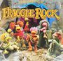 Text: "THE BEST OF FRAGGLE ROCK". Farbenfrohe Figuren in einer Höhle, die musizieren und fröhlich wirken.