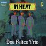 "IN HEAT", "Dee Felice Trio". Illustration mit drei Anzugträgern auf blau-grünem Hintergrund. Vintage-Stil.