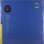 "This heat" in Gelb oben rechts; Songliste in Gelb links auf Blau; gelber Streifen links unten; minimalistisches Design.