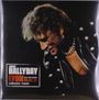 JOHNNY HALLYDAY, LYON 09.04.96, LORADA TOUR. Ein Mann in Lederjacke mit Ketten und blonder Frisur.