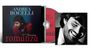 Cover mit den Worten "Andrea Bocelli", "30th Anniversary", "Romanza". Zeigt einen Mann im roten Hemd, schwarzer Hintergrund.