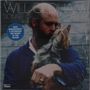 "Will Oldham, Songs of Love and Horror." Ein Mann hält liebevoll einen kleinen Hund im Arm.