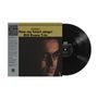 "Riverside: How my heart sings! Bill Evans Trio." Vinyl-Platte neben Albumcover mit einem Porträt eines Mannes.