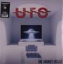 "UFO" und "THE MONKEY PUZZLE" auf einem Cover mit einem Raumschiff in einem futuristischen Raum.