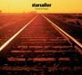 Text: "starsailor love is here". Ein Bahngleis führt in die Ferne unter einem orangefarbenen Himmel.