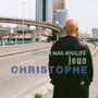 "BACHAR MAR-KHALIFÉ joue CHRISTOPHE" steht auf einem Bild, das einen Mann von hinten auf einer verlassenen Straße zeigt.