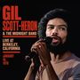 Text: "GIL SCOTT-HERON & THE MIDNIGHT BAND LIVE AT BERKELEY, CALIFORNIA JANUARY 16, 1978." 
Ein Mann singt ins Mikrofon.