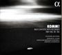 "KOMM! Bach Cantatas with Recorder BWV 106, 161, 182. Giovanni Antonini, NFM Boys’ Choir, Wrocław Baroque Ensemble."   
Ein Kiesel auf dunklem Sand unter bewölktem Himmel.