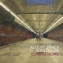 Text: "August Zirner Sven Faller Coming Home". Eine U-Bahn-Station, einsame Atmosphäre, warme Lichter.