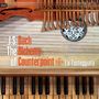 Text: J.S. Bach, The Alchemy of Counterpoint, La Tasteggiata. 
Zu sehen sind Teile von Musikinstrumenten.