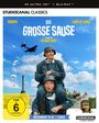 Oben steht „4K ULTRA HD™ + BLU-RAY™“. Zwei Männer in Uniformen, einer trägt den anderen Huckepack, mit Flugzeugen im Hintergrund.