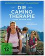 „Die Camino Therapie. Finde deinen Weg.“ Drei Personen mit Rucksäcken in einer bergigen Landschaft. FSK ab 12.