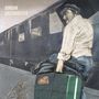 Texte: "GORDAN GASTARBEITER". Illustration eines Mannes mit Koffer vor einem Zug.