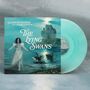 Ein Albumcover zeigt eine Frau in einem weißen Kleid und schwarze Schwäne vor einem Schloss bei Vollmond. Titel: The Lying Swans.