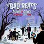 "The Bad Beats, Shiver & Shake, 14 Canadian Cold Cuts“: Winterlandschaft, Bandmitglieder mit Schallplatten, Cartoon-Stil.