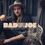 Texte: "BAD TEMPER JOE", "The Acoustic Blues Guitar Revue Vol. 1", "Original Songs of Bad Temper Joe".  
Ein Mann mit Gitarre und Hut.