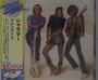 Text: "Disco", "シャラマー フレンズ＋5", "¥1,500". Drei Personen posieren, eine mit Gitarre und eine mit Bass. Japanische Schriftzeichen.