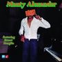"Monty Alexander", "Rass!", "featuring Ernest Ranglin". Ein Mann mit offenem Hemd hält ein Schild vor seinem Gesicht, in der Nähe eines Klaviers.