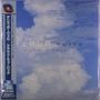Text: "CLOUD musiC", "DENNIS BOVELL", seitlich auf Japanisch. Ein blauer Himmel mit weißen Wolken.
