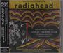 Texte: "radiohead", "Live at the RPM Club", "June 6th 1995 at 9:00 P.M." Bild: Bunte, wellenförmige Linien, Gesicht im Profil.