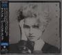 Schwarz-weißes Cover mit "MADONNA" vertikal am Rand. Frau mit lockigem Haar und Armbändern. Japanischer Text links.