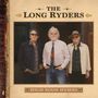 "The Long Ryders" oben, "High Noon Hymns" unten. Drei Männer mittleren Alters stehen nebeneinander, einer mit Hut.