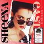 Auf rotem Hintergrund steht "SHOCKWAVE" und "SHEENA EASTON". Frau mit kurzen Haaren und Sonnenbrille im Vordergrund.