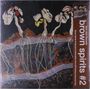 Text: „Soul Jazz Records brown spirits #2“. Illustration von Pflanzenwurzeln und Blättern auf dunklem Hintergrund.
